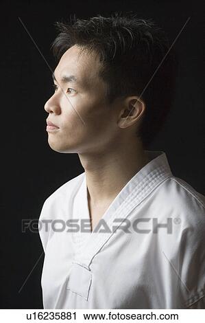 Close-up of a young man contemplating View Large Photo Image Stock Image - Close-up of a young man contemplating. Fotosearch