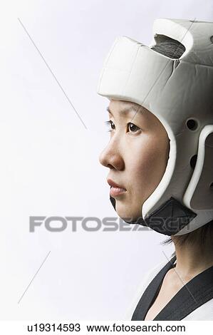 Close-up of a young woman wearing a sports helmet View Large Photo Image Stock Image - Close-up of a young woman wearing a sports helmet. Fotosearch