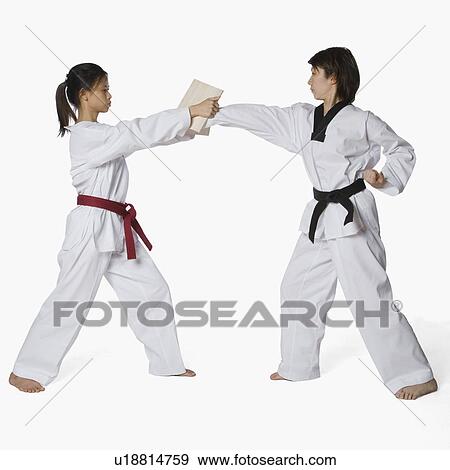 Stock Photo - Female karate instructor teaching martial arts to a young woman. Fotosearch