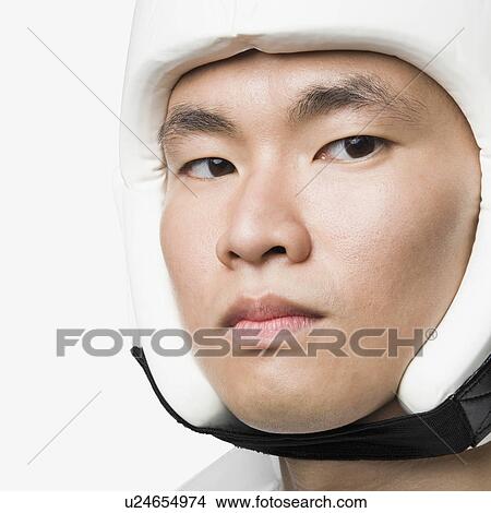 Portrait of a young man wearing a sports helmet View Large Photo Image Picture - Portrait of a young man wearing a sports helmet. Fotosearch