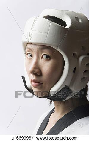 Portrait of a young woman wearing a sports helmet View Large Photo Image Stock Photo - Portrait of a young woman wearing a sports helmet. Fotosearch