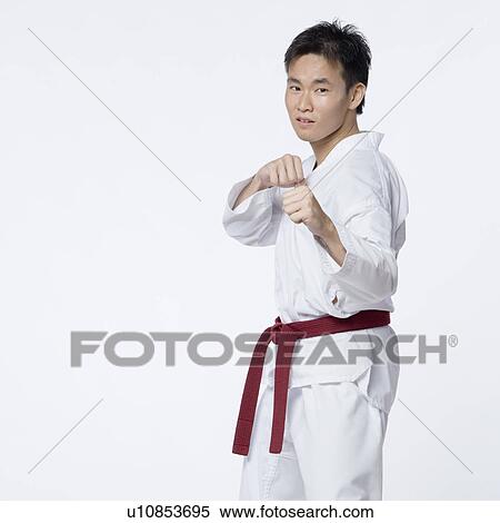 Young man in fighting stance View Large Photo Image Stock Photography - Young man in fighting stance. Fotosearch