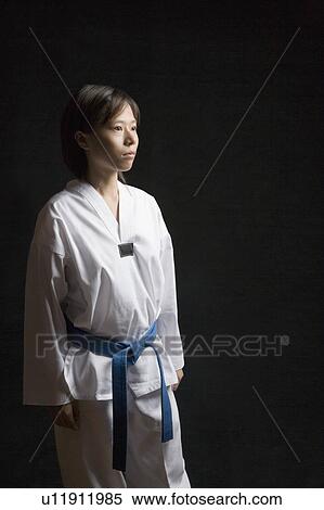 Stock Photography - Young woman standing. Fotosearch