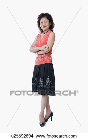 Portrait of a senior woman standing with her arms crossed View Large Photo Image Picture - Portrait of a senior woman standing with her arms crossed. Fotosearch