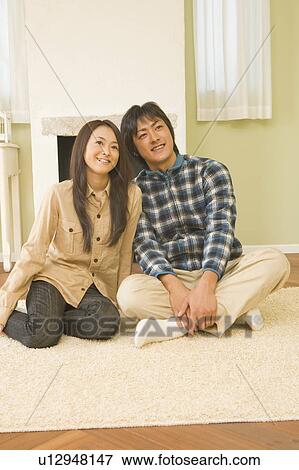 Stock Photo - Young couple relaxing. Fotosearch