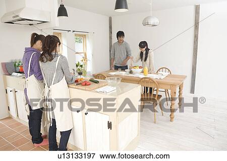 Young people preparing home party View Large Photo Image Stock Photo - Young people preparing home party. Fotosearch