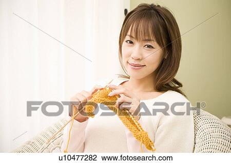 Young woman knitting View Large Photo Image Stock Image - Young woman knitting. Fotosearch