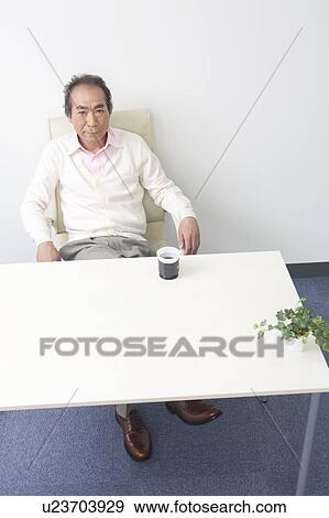 Businessman sitting View Large Photo Image Stock Photo - Businessman sitting. Fotosearch
