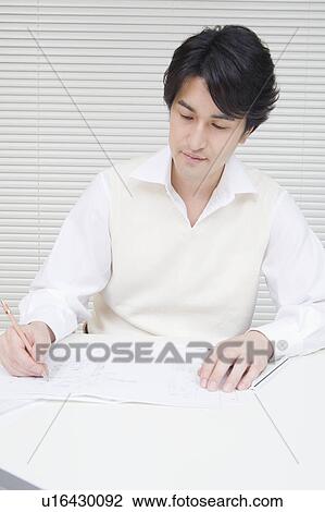 Businessman writing in office View Large Photo Image Stock Image - Businessman writing in office. Fotosearch