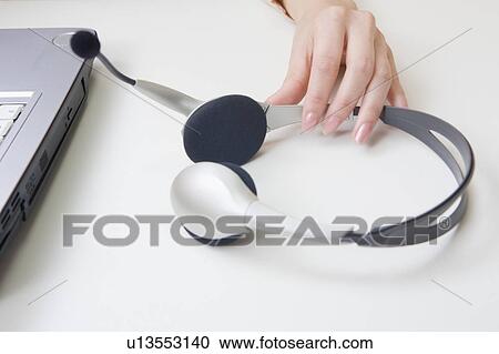 Stock Image - Headset and computer. Fotosearch