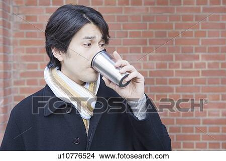 Mid adult man drinking coffee View Large Photo Image Picture - Mid adult man drinking coffee. Fotosearch