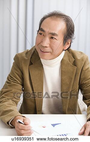 Portrait of Mature Man in office View Large Photo Image Stock Image - Portrait of Mature Man in office. Fotosearch