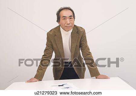Portrait of Mature Man in office View Large Photo Image Stock Image - Portrait of Mature Man in office. Fotosearch