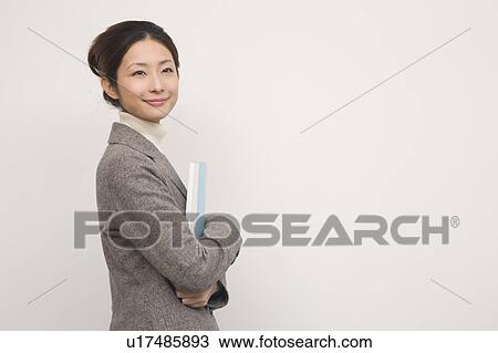 Portrait of young man in office View Large Photo Image Stock Image - Portrait of young man in office. Fotosearch