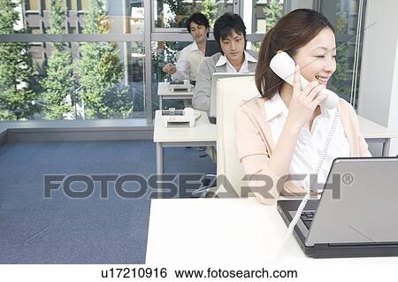 Three people working in office View Large Photo Image Stock Photograph - Three people working in office. Fotosearch