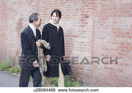 Stock Photograph - Two businessmen in winter clothes. Fotosearch