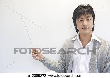 Young man pointing board View Large Photo Image Stock Image - Young man pointing board. Fotosearch