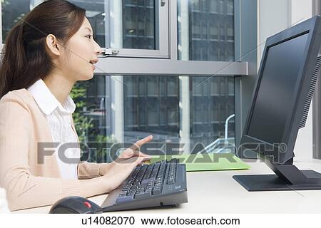 Young woman looking computer display View Large Photo Image Stock Image - Young woman looking computer display. Fotosearch
