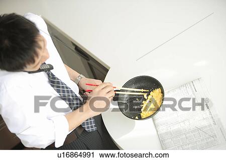 Businessman cooking in kitchen View Large Photo Image Stock Image - Businessman cooking in kitchen. Fotosearch