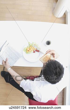 Businessman having breakfast View Large Photo Image Picture - Businessman having breakfast. Fotosearch