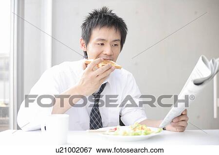 Businessman having breakfast View Large Photo Image Stock Photo - Businessman having breakfast. Fotosearch