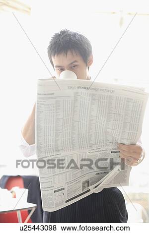 Businessman reading newspaper View Large Photo Image Stock Photo - Businessman reading newspaper. Fotosearch