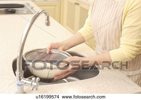 Picture - Human Hand cutting vegetables. Fotosearch