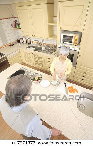 Senior couple cooking View Large Photo Image Stock Photo - Senior couple cooking. Fotosearch