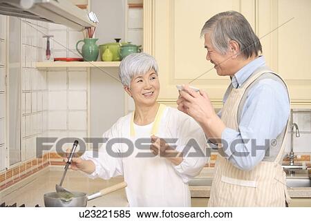 Senior couple cooking View Large Photo Image Stock Photography - Senior couple cooking. Fotosearch