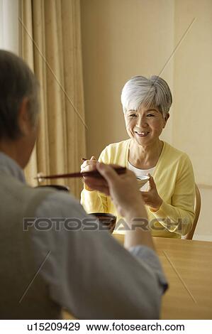 Stock Photo - Senior couple having meal. Fotosearch