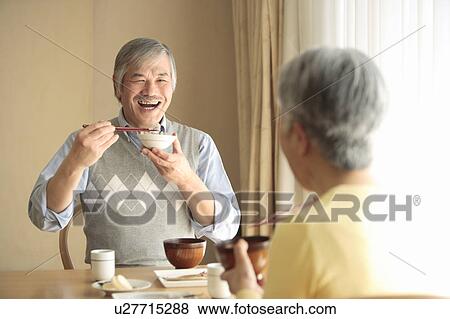 Stock Photo - Senior couple having meal. Fotosearch