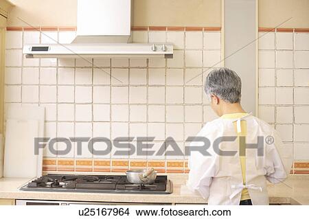 Senior woman cooking View Large Photo Image Picture - Senior woman cooking. Fotosearch
