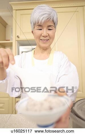 Senior woman cooking View Large Photo Image Stock Photo - Senior woman cooking. Fotosearch