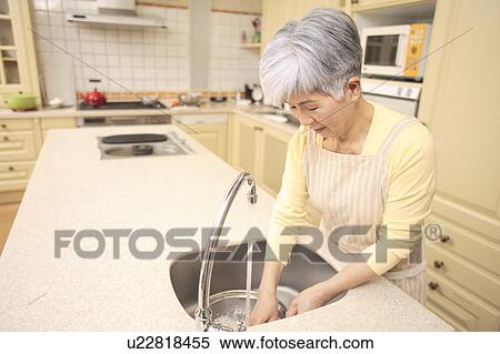 Senior woman cooking View Large Photo Image Stock Photography - Senior woman cooking. Fotosearch