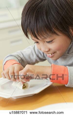 Boy cooking pot-sticker View Large Photo Image Stock Image - Boy cooking pot-sticker. Fotosearch