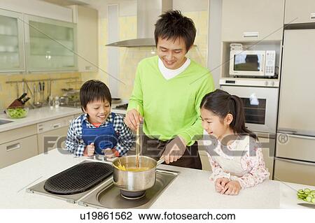 Father and children cooking View Large Photo Image Stock Image - Father and children cooking. Fotosearch