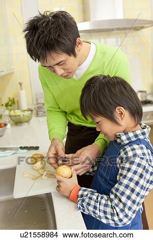 Picture - Father and son cooking. Fotosearch
