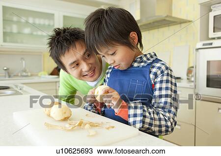 Father and son cooking View Large Photo Image Stock Image - Father and son cooking. Fotosearch