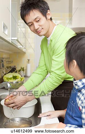 Father and son cooking View Large Photo Image Stock Photo - Father and son cooking. Fotosearch