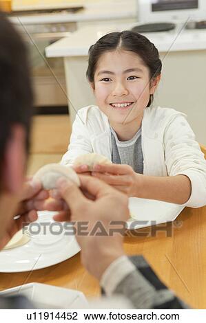 Girl cooking pot-sticker View Large Photo Image Stock Image - Girl cooking pot-sticker. Fotosearch