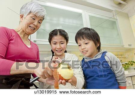 Grandmother cooking with grandchildren View Large Photo Image Stock Photography - Grandmother cooking with grandchildren. Fotosearch