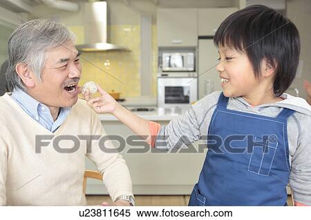 Grandson serving rice ball to grandfather View Large Photo Image Stock Photography - Grandson serving rice ball to grandfather. Fotosearch