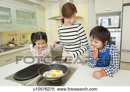 Mother and children cooking View Large Photo Image Stock Photography - Mother and children cooking. Fotosearch