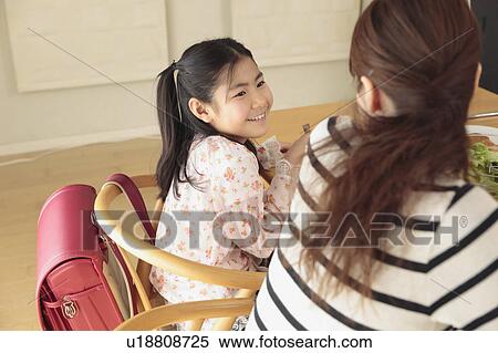 Mother and daughter having breakfast View Large Photo Image Stock Photography - Mother and daughter having breakfast. Fotosearch