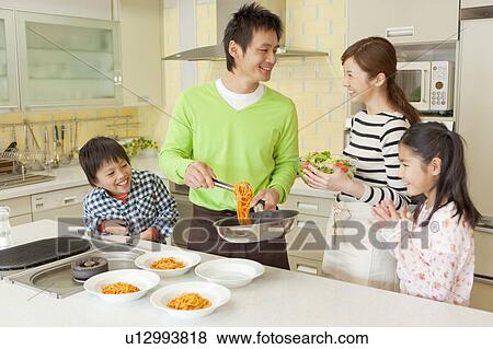 Parents and children cooking View Large Photo Image Stock Photo - Parents and children cooking. Fotosearch