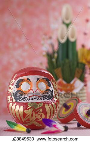 Stock Image - Daruma doll and kadomatsu. Fotosearch