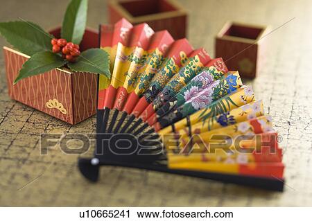 Stock Image - Fan and Japanese wooden measure cup. Fotosearch