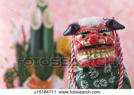 Stock Image - Lion dance and kadomatsu. Fotosearch