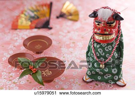 Lion dance ornament and sake cup View Large Photo Image Stock Image - Lion dance ornament and sake cup. Fotosearch