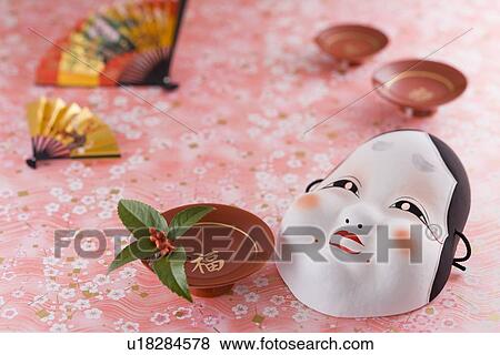 Stock Photo - Mask of plain woman and sake cup. Fotosearch